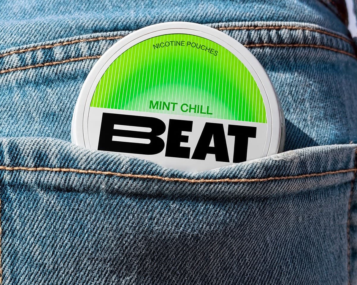 A Beat Mint Chill nicotine pouch tin in a denim jeans pocket