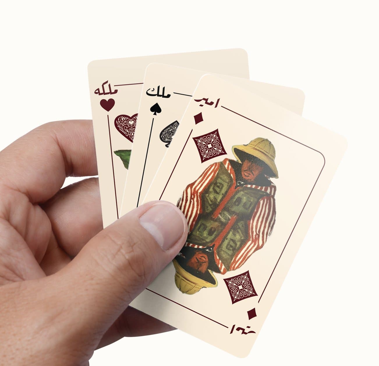 A hand holding a fanned set of Middle Feast branded playing cards